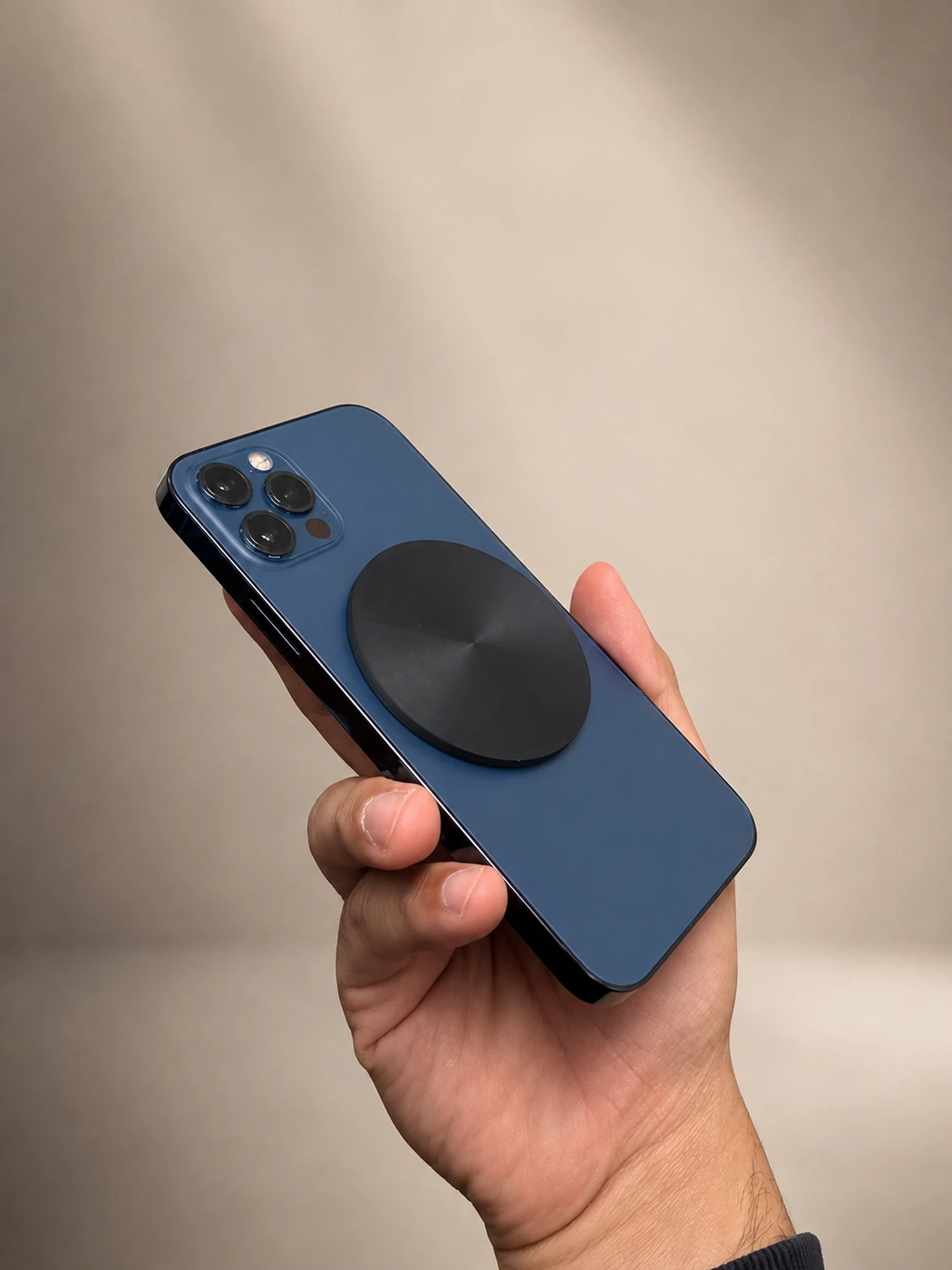 Matte black Forje Link attached to a blue iPhone